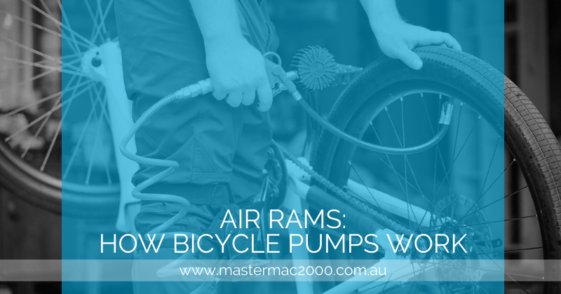 man pumping air to bicycle tire